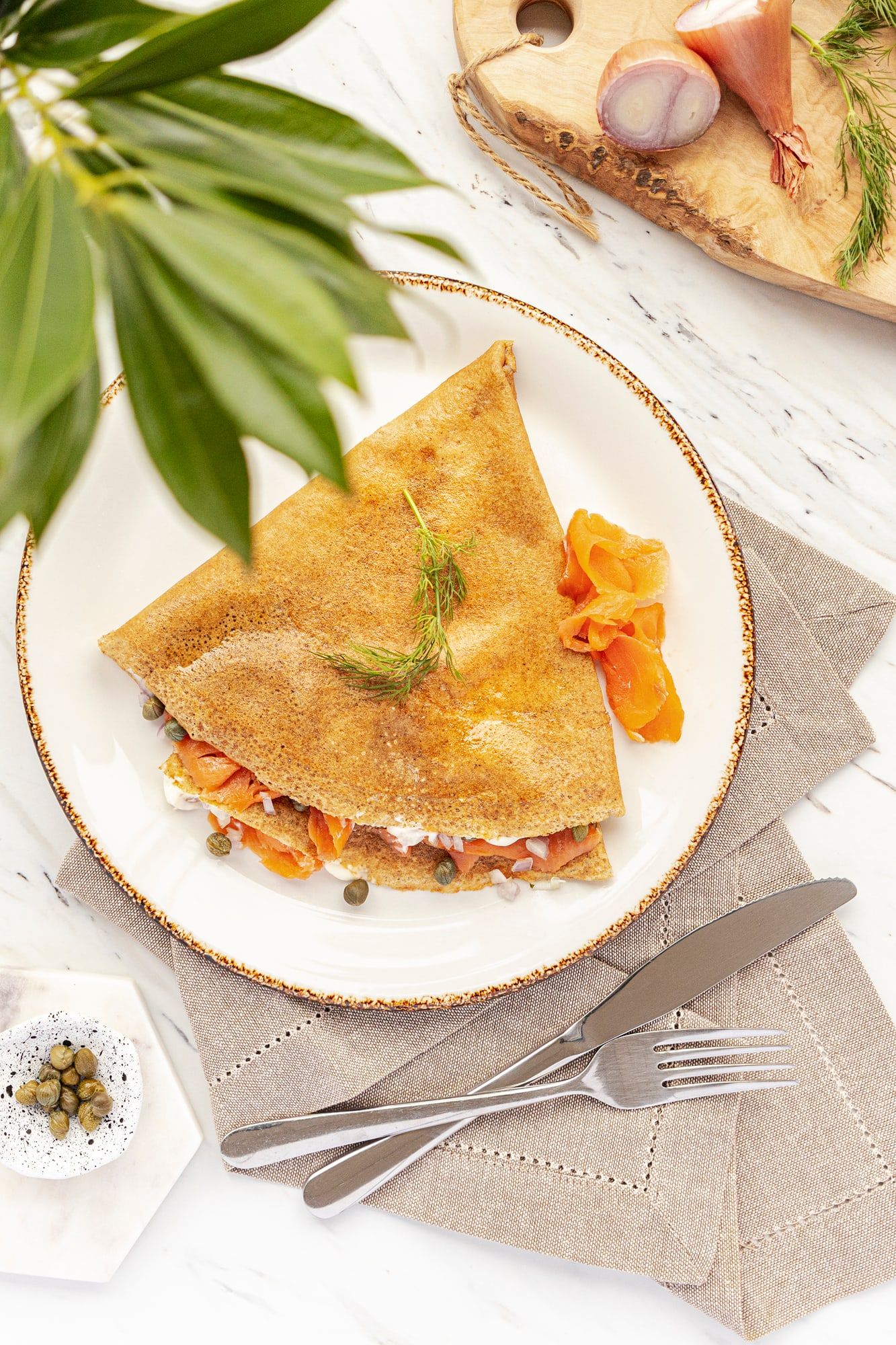 A savoury buckwheat crêpe filled with smoked salmon, capers and dill